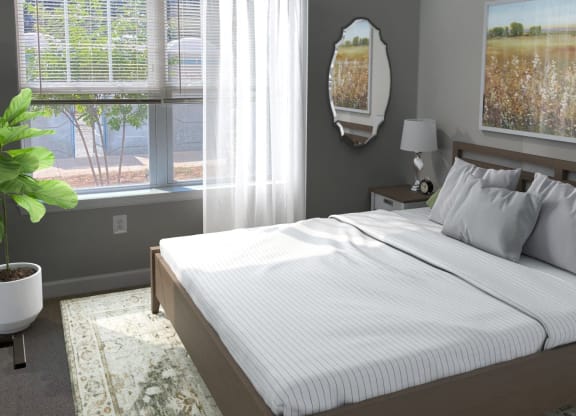 a bedroom with a bed and two windows