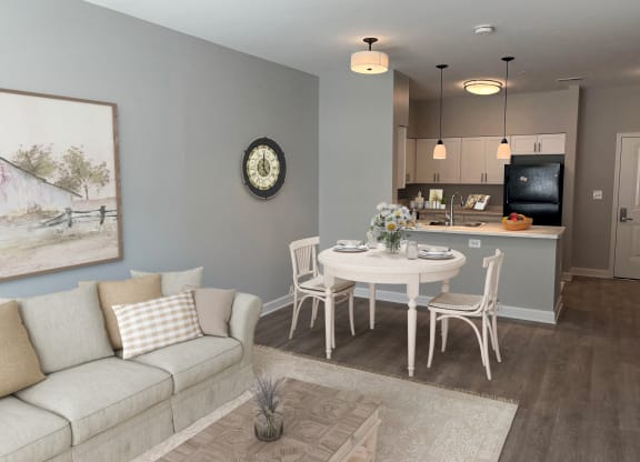 a living room and dining room with a couch and a table