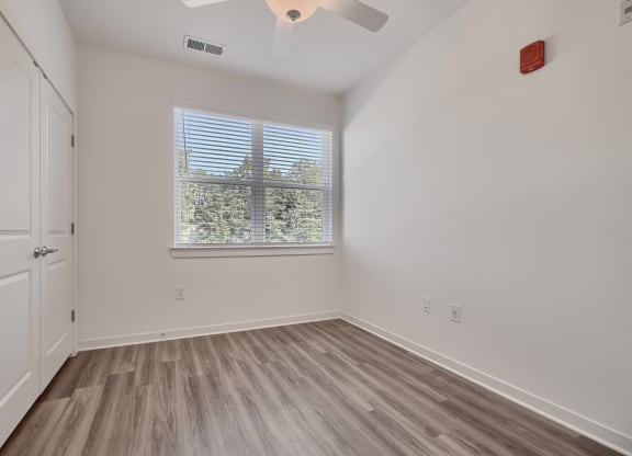 bedroom with window and closet