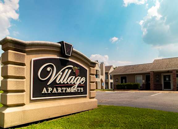 The Village Apartments Sign