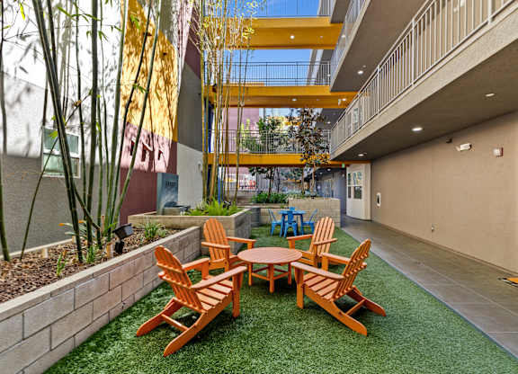 A patio with a table and chairs.