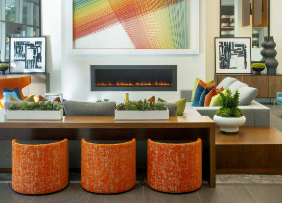Woodland Hills Luxury Apartments - The Q Variel - Lobby with Various Comfortable Seating Options, Luxury Finishes, and a Fireplace