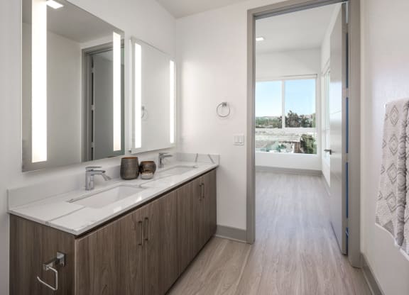a bathroom with a large mirror and a sink