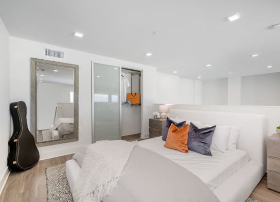 Lofts for Rent Woodland Hills, CA - The Q Variel - Loft Bedroom with a Closet and Luxury Wood Plank Style Flooring