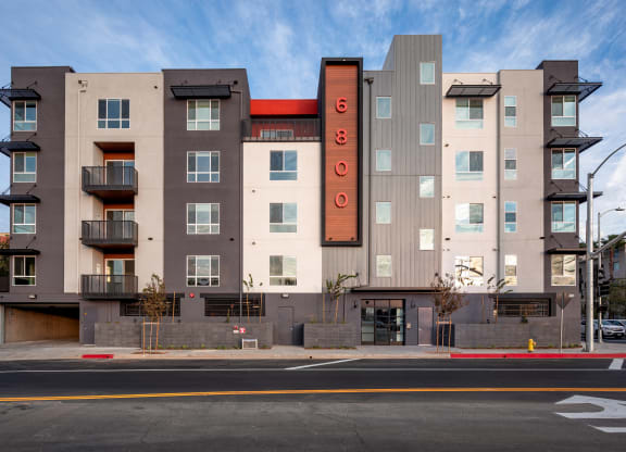 a large apartment building with a sign on the side of it