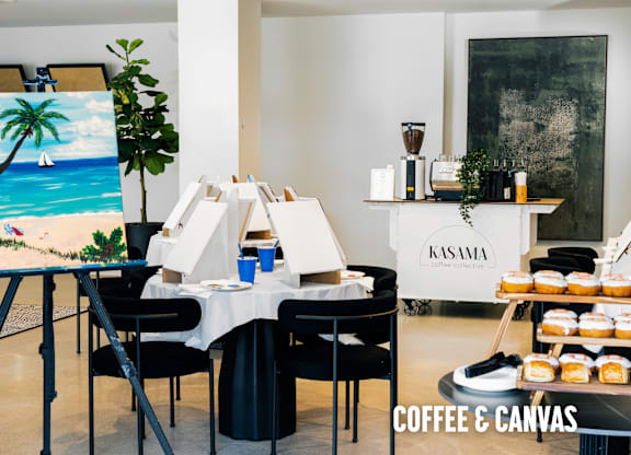 A painting of a beach scene is displayed in a room with a coffee and canvas theme.