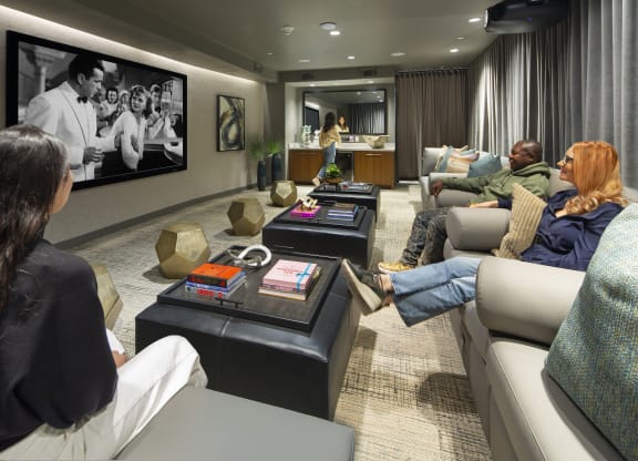 a living room filled with furniture and a large flat screen tv