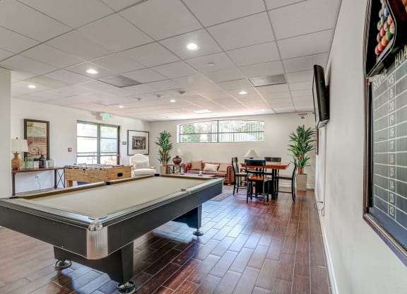 a pool table in the living room of a house at Le Blanc Apartment Homes, Canoga Park, 91304