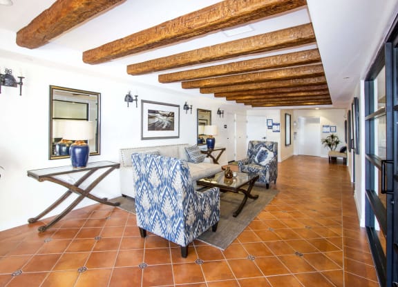 a living room with a couch and chairs and a table at Le Blanc Apartment Homes, Canoga Park, 91304