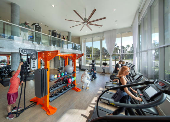 a group of people exercising in a gym