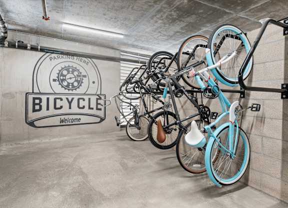 A bicycle parking area with a sign that says "Bicycle Welcome".
