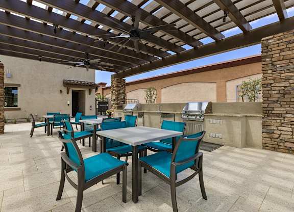 Outdoor BBQ Grill with Intimate Seating Area at Pillar Lago
