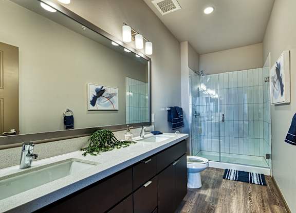 Double sink vanity and walk-in shower at Cuvee, Arizona