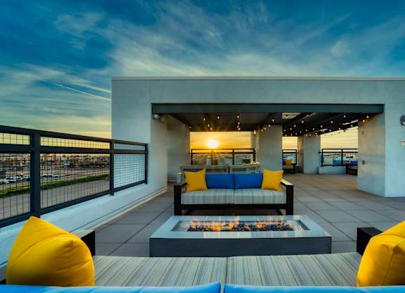 Rooftop patio with tables and chairs and firepit at Cuvee, Glendale, AZ 85305