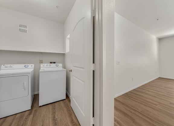 A laundry room with a washer and dryer.