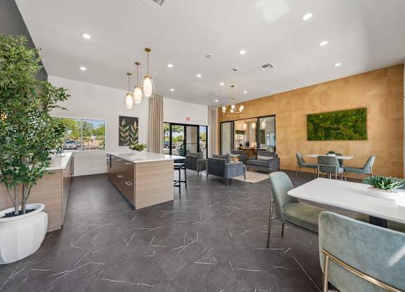 A modern interior with a dining area and a kitchen.