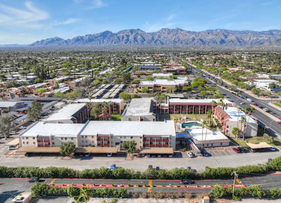 A large industrial area with a mountain range in the background.