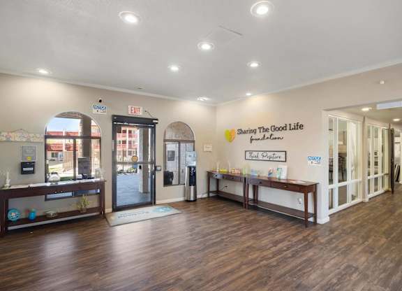 A reception area with a sign that says "Sharing the Good Life".