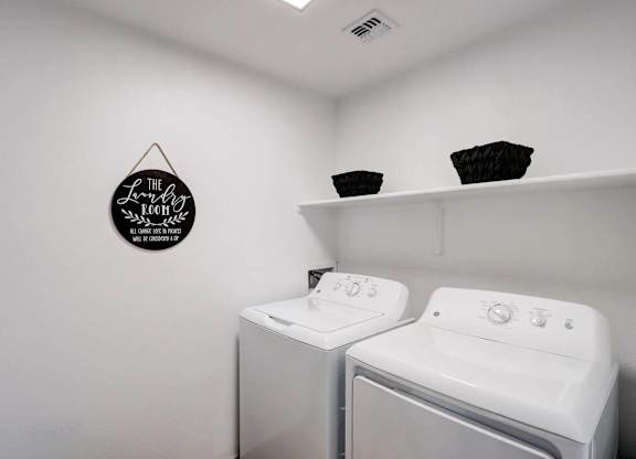A laundry room with a washer and dryer.
