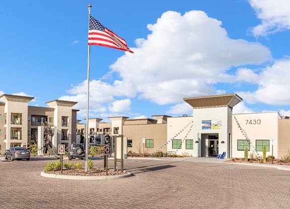 The building number 7430 is visible on the side of the building.