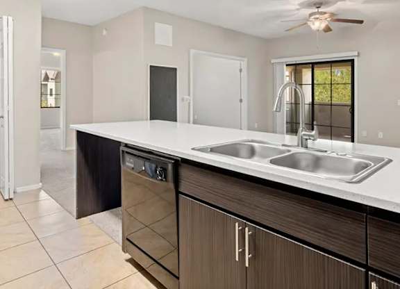 A modern kitchen with a dishwasher and a sink.
