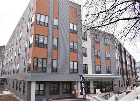 a condo building on the corner of a city street