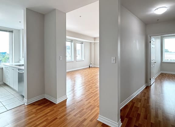 A room with wooden floors and white walls.