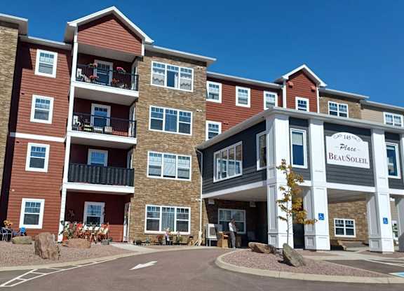 The image shows a multi-story building with the name "Place Beaulieu" on the front.