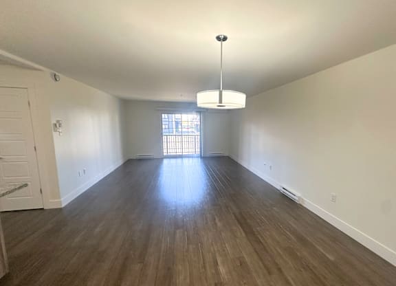 A room with wooden floors and a white ceiling.