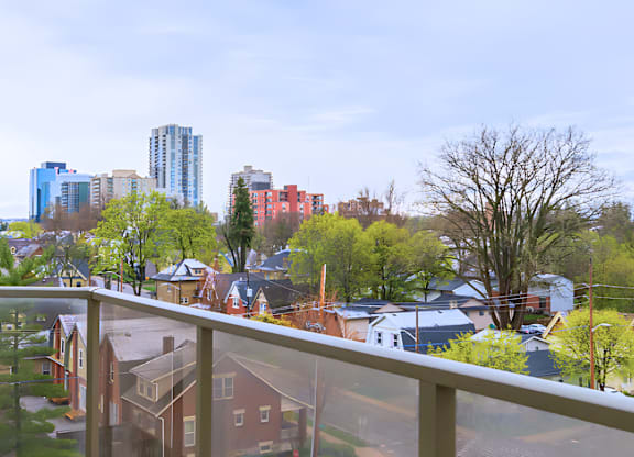 A view of a residential area with houses and trees.
