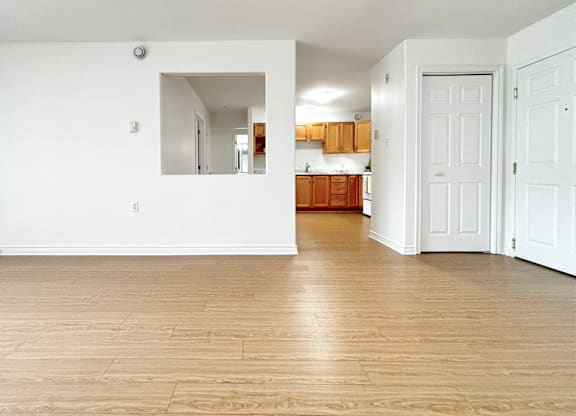 A room with wooden floors and white walls.