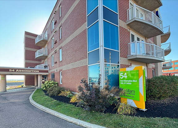 A building with a sign that says 54 Assomption.