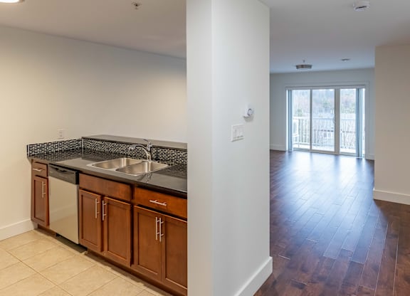 A kitchen with a sink and a counter top.