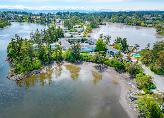 A small island with a building on it surrounded by water.