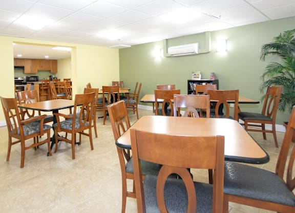 A room with tables and chairs.