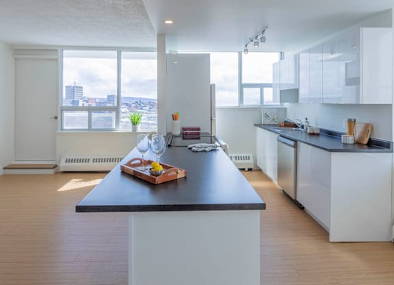A modern kitchen with a large island in the center.