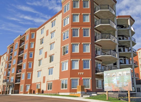 A large apartment building with the number 777 on the front.