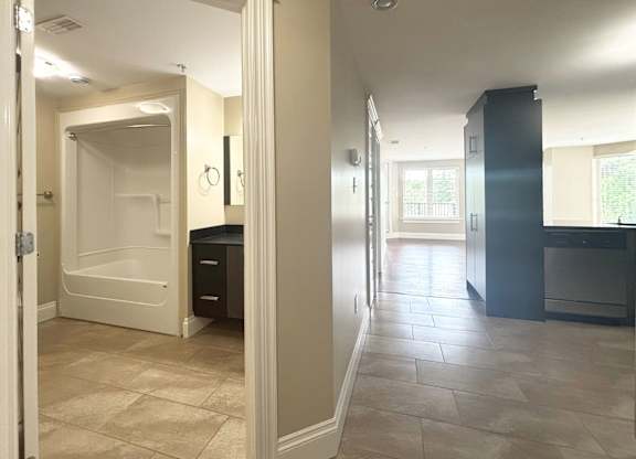 A bathroom with a walk-in shower and a vanity.