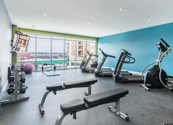 A gym with a view of the city.