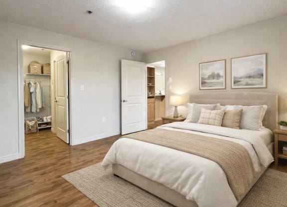 A bedroom with a large bed and a wardrobe.