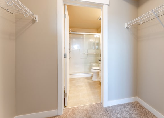 A white bathroom with a toilet and sink.