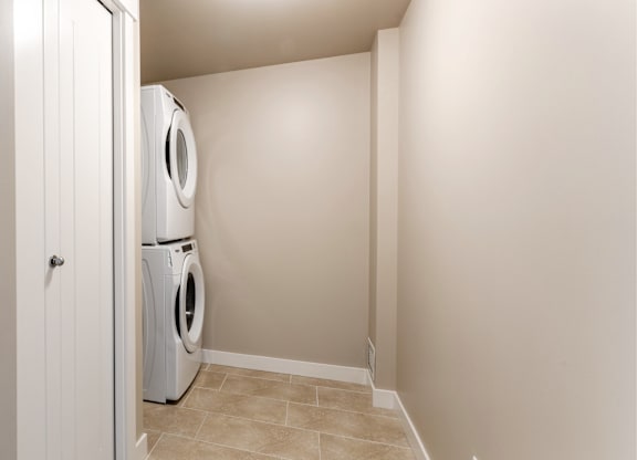 A laundry room with a washer and dryer in it.
