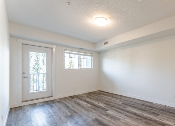 A room with a door and a window.