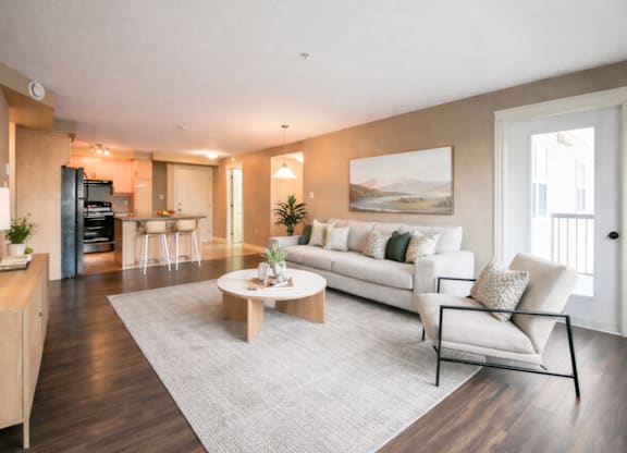A modern living room with a white sofa and a coffee table.
