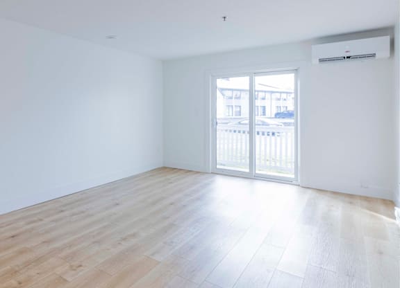 A room with a sliding door and a window.