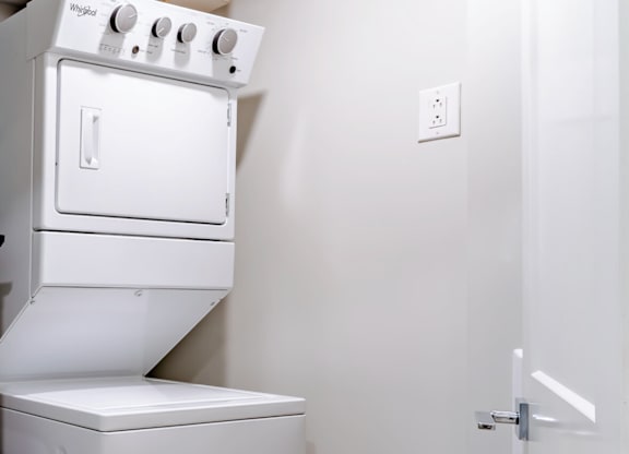 A white oven and dishwasher in a kitchen.