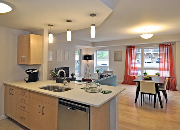 A kitchen with wooden cabinets and a white countertop.