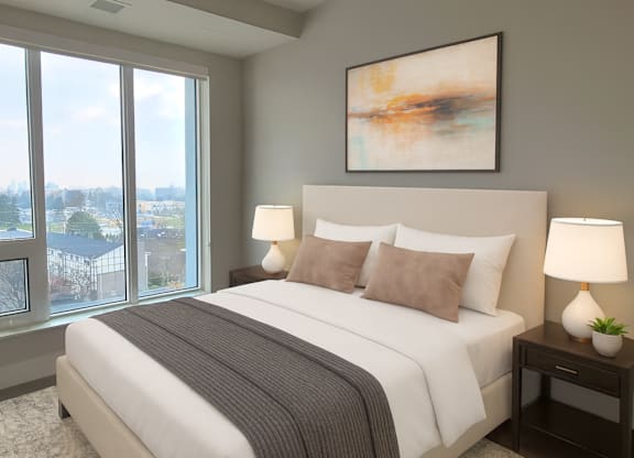 A bedroom with a large bed and a painting on the wall.