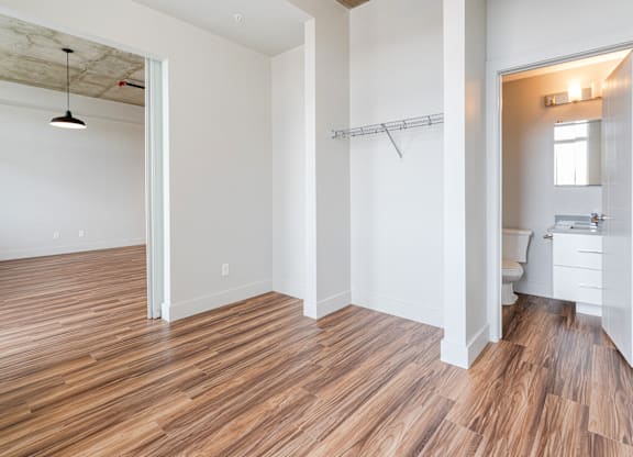 A room with wooden floors and white walls.