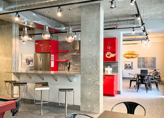 A modern interior with a red cabinet and a concrete pillar.